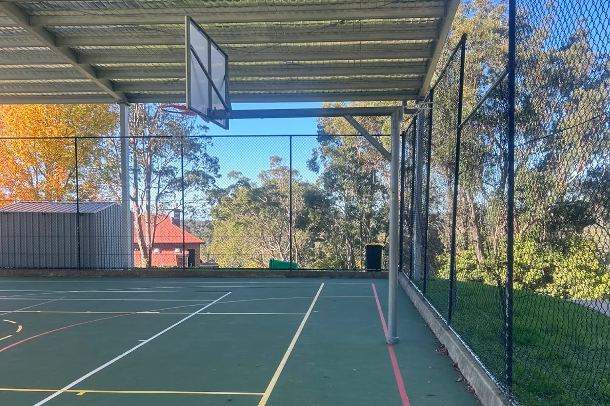Covered sports court chain wire enclosure